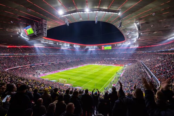 Big crowd in Allianz Arena watching a soccer match